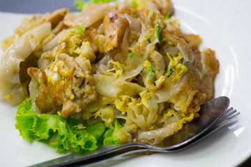 Stir fried flat noodle and chicken and egg Thai street food