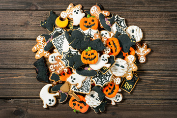 homemade traditional Halloween icing sugar cookies on the wooden table - Powered by Adobe