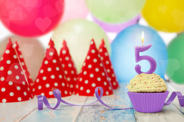 Cupcake with candle in number 5 shape