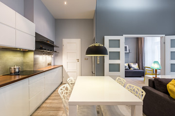 Modern kitchen with dining table