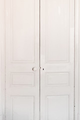 Fototapeta premium White Old classic door. Antique dirty door in a room, closed.