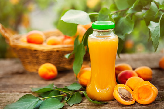 Bottle with apricot juice and apricots