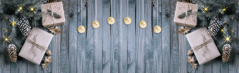 Christmas banner with gifts, glowing stars and hanging balls in vintage style on wooden planks