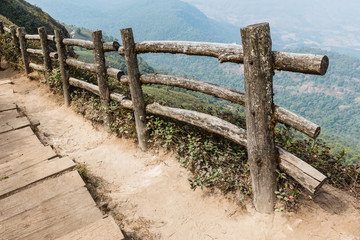 Log fence along the way at Kew Mae Pan in Chiang Mai, Thailand.