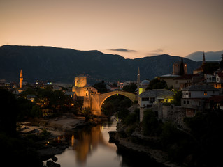Fototapeta na wymiar Sunset scene of the old city and the restored Old Bridge (Stari Most), in Mostar, Bosnia and Herzegovina