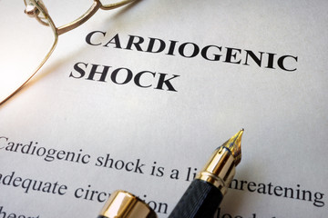 Paper with word cardiogenic shock and glasses.
