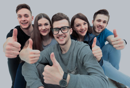 successful student and his friends sitting holding a thumb up an