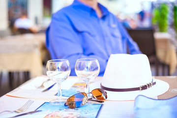 Table at outdoor restaurant in Europe, person in background
