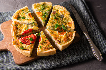 Pieces of quiche lorraine with bacon and cheese. French cuisine.