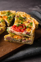 Pieces of quiche lorraine with bacon and cheese. French cuisine.