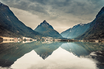 Obraz premium Reflection of mountains in norwegian fjord lake