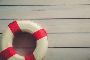 life saver on a blue wooden background