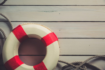 life saver on a blue wooden background