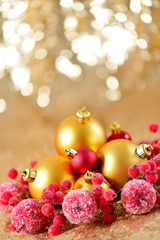 Fototapeta na wymiar Christmas background, new year close up red and gold decoration balls on glitter abstract blurred holiday bokeh background