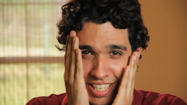 Close up, man acts embarrassed