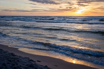 Fototapeta na wymiar Beautiful sunset over Baltic Sea - seascape with sea horizon