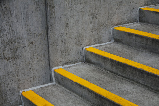 Orange paint stripes on concrete steps