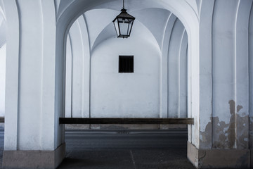 White round arches with vintage lamp