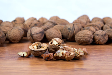 A lot of scattered walnuts close-up. A useful product.