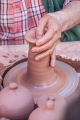 Man doing with his hands and I sweep jars                                        Hands, mud and crafts
