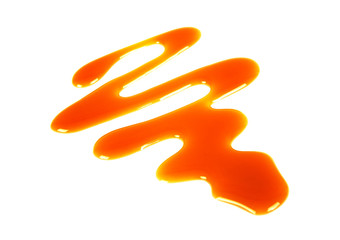 Sweet caramel sauce isolated on a white background
