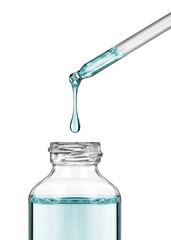 Drop falls from a pipette into a cosmetic bottle close-up on white background