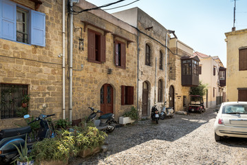 Fototapeta na wymiar Street with old houses in Rhodes town on Rhodes island, Greece