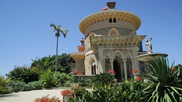 Sintra, Portugal famous landmark. Panorama of the arabesque Monserrate Palace or Palacio de Monserrate, the summer resort of Portuguese court. European travel. Sunny day in the blue sky.