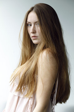 portrait of young woman with long hair