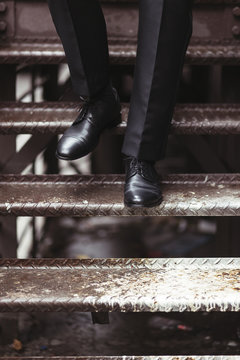 Closeup Of A Business Man's Shoes As He's Walking Down The Stairs