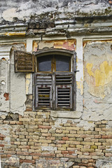 Fototapeta na wymiar Old devastated house and window