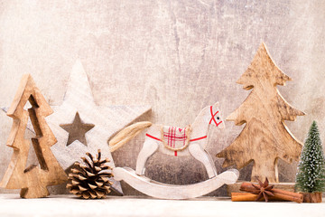 Christmas tree decorations on a wooden background. With bokeh ornaments.