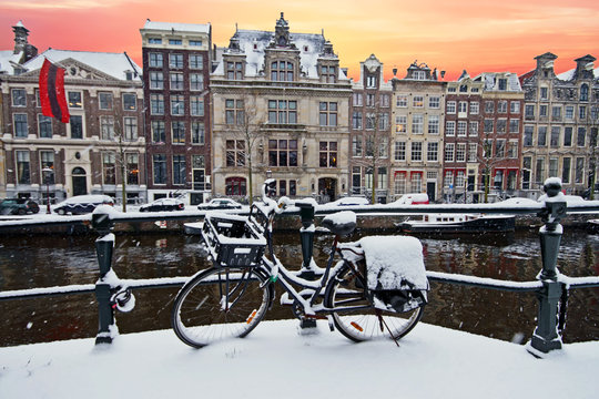 Amsterdam in winter in the Netherlands at sunset © Nataraj