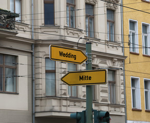 two road signs with the arrow and the indications of the two mos