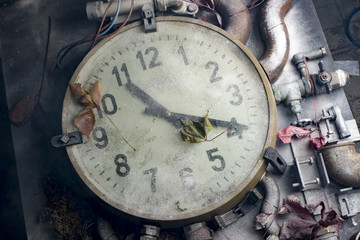 Large wall clock on the table with details and smoke