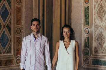 Beautiful caucasian couple holding hands