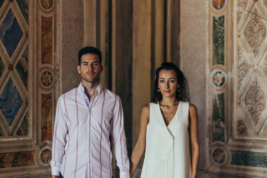 Beautiful caucasian couple holding hands