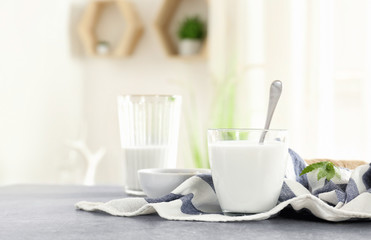 Glass with hemp milk on table