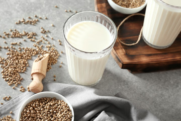 Glass with hemp milk on table