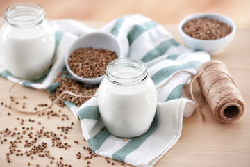 Beautiful composition with hemp milk on table