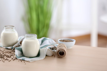 Beautiful composition with hemp milk on table