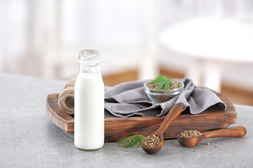 Beautiful composition with hemp milk on table