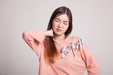 Young Asian woman got neck pain.