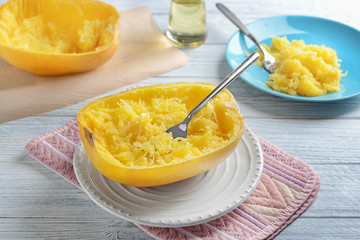 Tasty spaghetti squash with fork on plate