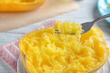 Fork with flesh of spaghetti squash, closeup
