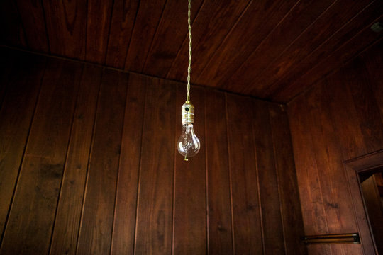 A single lightbulb hanging from a cord.