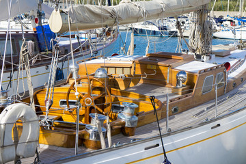 Old sailboat detail / Detailed view of an old white, wooden sailboat at Bolsena lake, near Rome, italy in a clear, sunny day
