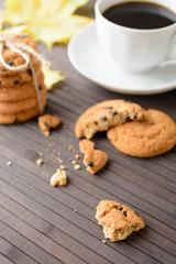 A Cup of hot coffee and oatmeal cookies. Autumn still life