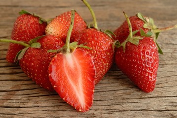 red ripe strawberries on wooden table