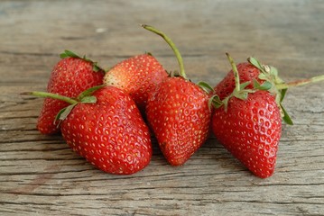 red ripe strawberries on wooden table